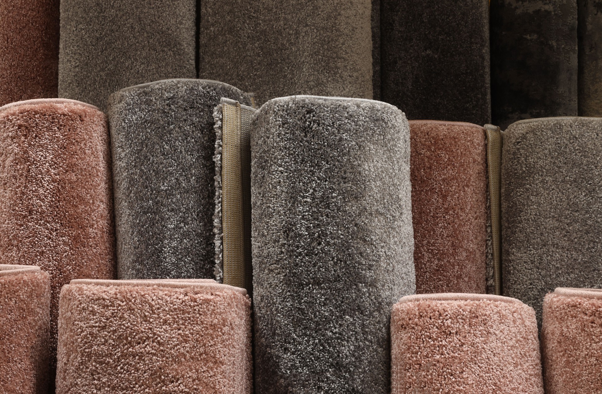 Carpets variety selection rolled up rugs shop store lot. Interior design concept idea