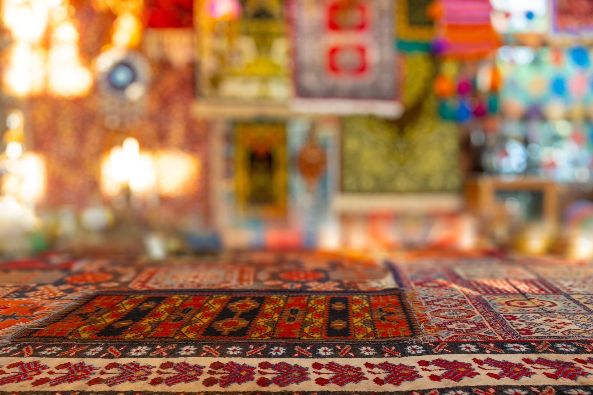 Turkish Istanbul Grand Bazaar carpet and lantern blur decoration montage for advertising background.