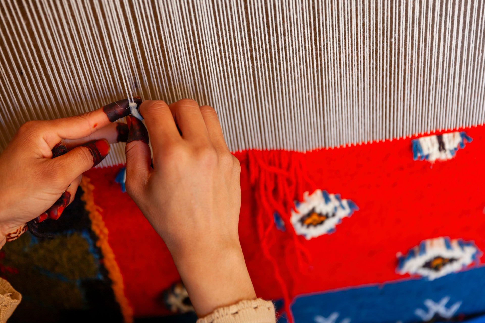 Berber woman weaving textiles, Ouarzazate, Morocco